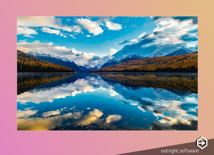 a pink - peach border and a serene photograph of mountains and blue skies reflected on a clear lake in Montana.